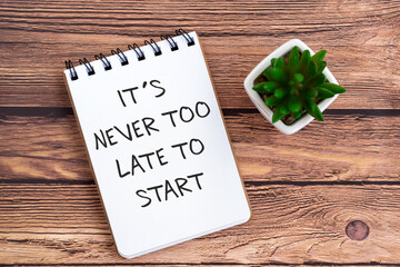 Wall Mural - Inspirational quotes on note pad - Its never too late to start.