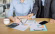 © boonyawat - Bussiness concept, Bussiness woman working discussing the charts and graphs showing
