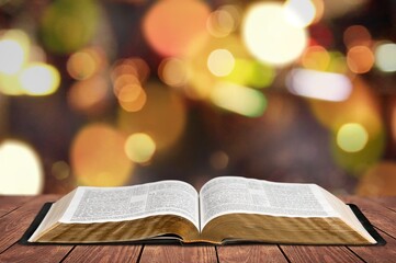 Wall Mural - open book on old wooden table.