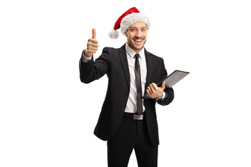 Poster - Businessman with a clipboard and documents showing thumbs up and wearing a santa claus hat