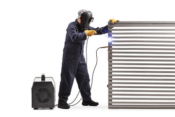 Full length shot of a welder welding a metal door