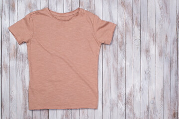 Color paint t-shirt with copy space. T-shirt mockup, flat lay.