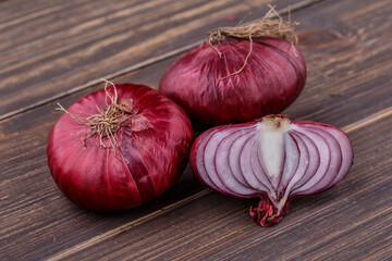 red onions on rustic wood