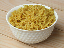 Maggie Noodles, Instant Noodles Served In A Bowl Over A Rustic Wooden Background, Selective Focus