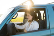 © VITTA GALLERY/Westend61 - Beautiful woman on road trip driving car during sunset
