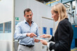 © Daniel Ingold/Westend61 - Female entrepreneur and male colleague using digital tablet while standing in industry