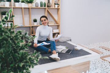 Canvas Print - Cheerful woman doing paperwork at home