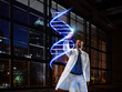 © Roger Richter Photography/Westend61 - Mature male doctor light painting DNA in laboratory at hospital