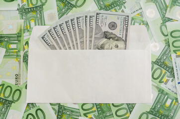 100 dollars in a white envelope on the background of euro .set of banknotes,