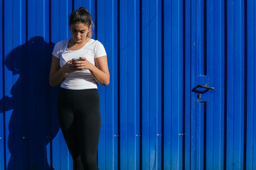 Sticker - Closeup shot of a cute attractive female looking at her telephone