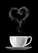 Coffee with love. Cap of coffee with heart symbol made of steam isolated on black background
