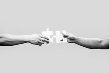 Hand Connecting Jigsaw Puzzle. Business Solutions, Success And Strategy Concept