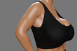 Young slim woman with big breasts in black sportswear