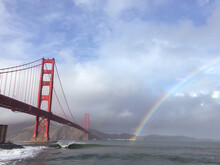 A Rainbow And Waves Next To The Golden Gate Bridge