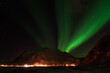 North green lighting of aurora over the mountains in Lofoten island Norway