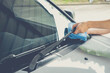 Cleaning a windshield wiper with microfiber cloth