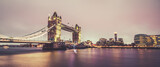 Fototapeta Londyn - Tower Bridge in London illuminated at dusk