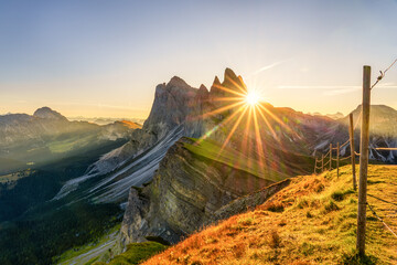 Poster - Amazing sunrise of Seceda peak with sun flare. Trentino Alto Adige, Dolomites Alps, South Tyrol, Italy, Europe