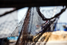 Fisherman Repairing Fishing Nets.