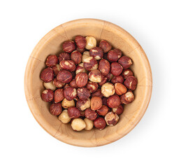 Wall Mural - Hazelnuts in a wooden bowl on a white background, top view