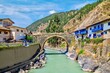 The picturesque colonial Carlos Tercero bridge, built in 1775, spanning the Mapacho River in the town of Paucartambo, in the Cusco region in southern Peru.
