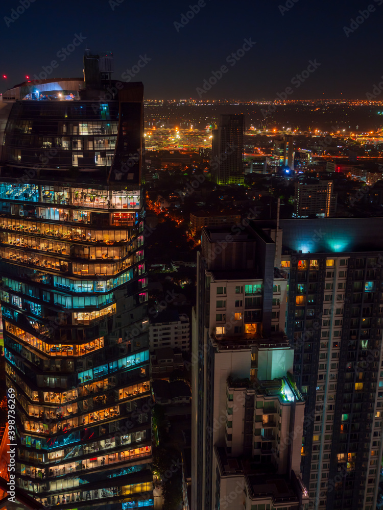 Bangkok highrise office building and apartment with light illumination at night time. - obrazy, fototapety, plakaty 