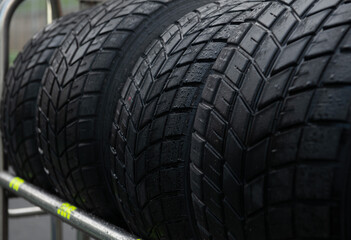 Wet tire set close up, motorsport car racing equipment