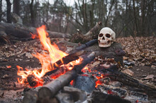 Rite By The Fire. Rite Of Passage With Human Skulls By The Fire.