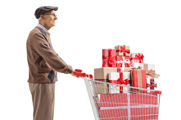 Poster - Elderly man standing with a shopping cart full of presents