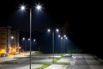 Wall Mural - empty parking area with safety modern illumination at night