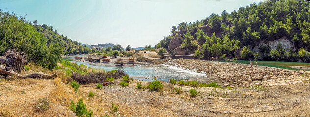 A panorama view across the Alahara river in the Alaharan valley in Turkey in the summertime