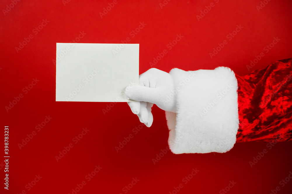 Santa Claus hand holding empty Christmas card. Mock up blank sign Stock ...
