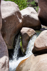 Wall Mural - Small waterfall. the water comes from the stones, in cordoba. Argentina.