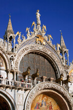 West Front Detail Of The Basilica Di San Marco, Showing The Prancing Horses And Other Ornate Detail: San Marco, Venice, Italy