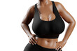 © PixlMakr - Young slim woman with big breasts in black sportswear
