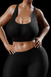 © PixlMakr - Young slim woman with big breasts in black sportswear