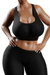 © PixlMakr - Young slim woman with big breasts in black sportswear