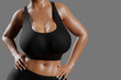 © PixlMakr - Young slim woman with big breasts in black sportswear