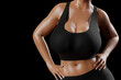© PixlMakr - Young slim woman with big breasts in black sportswear