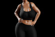 © PixlMakr - Young slim woman with big breasts in black sportswear