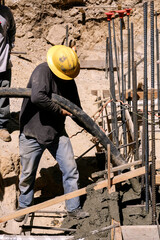 Wall Mural - Placing pumped concrete with a large hose