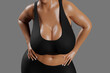 © PixlMakr - Young slim woman with big breasts in black sportswear