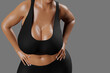 © PixlMakr - Young slim woman with big breasts in black sportswear