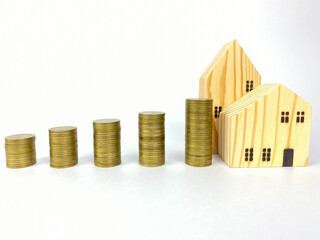 Business, Money, Finance  Concept
Model house coins stack,  money saving.Stack of money coin for saving for home, property with Wealth and saving plan for house mortgage. Personal investment concept.