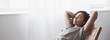 Leinwandbild Motiv Young woman relaxing at home panoramic banner. African american girl resting in her room. Enjoy life, rest, relaxation, wellbeing, lifestyle, people, recreation concept