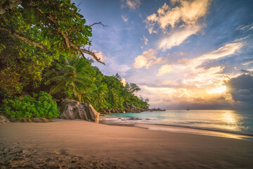 Wall Mural - beautiful sunset on tropical beach at anse georgette, praslin, seychelles