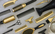 Background with gold and black hair salon accessories. Hairdressers tools, Wallpaper in trendy gray and yellow colors.
