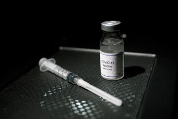 covid 19 corona virus vaccine injector black background