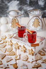 christmas still life with gingerbread cookies and mulled wine on wooden background