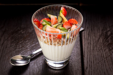 yoghurt dessert with fresh sliced fruit strawberry kiwi feijoa